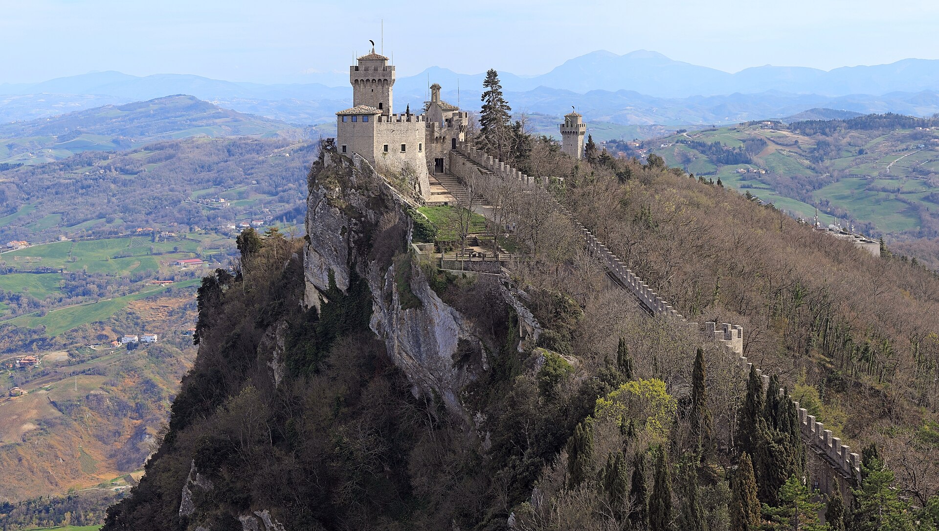 Cesta and Montale towers seen from Monte Titano, San Marino — a UNESCO World Heritage Site visible from the closing holes at Rimini Verucchio Golf Club.
