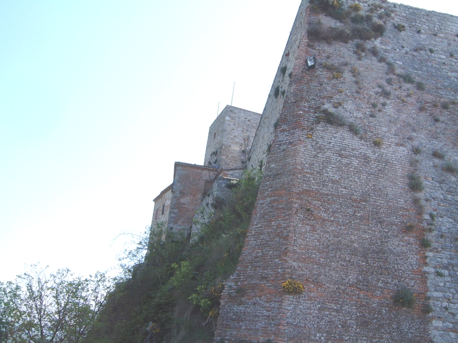 Rocca Malatestiana in Verucchio — the medieval Malatesta fortress on a limestone outcrop above Rimini Verucchio Golf Club.